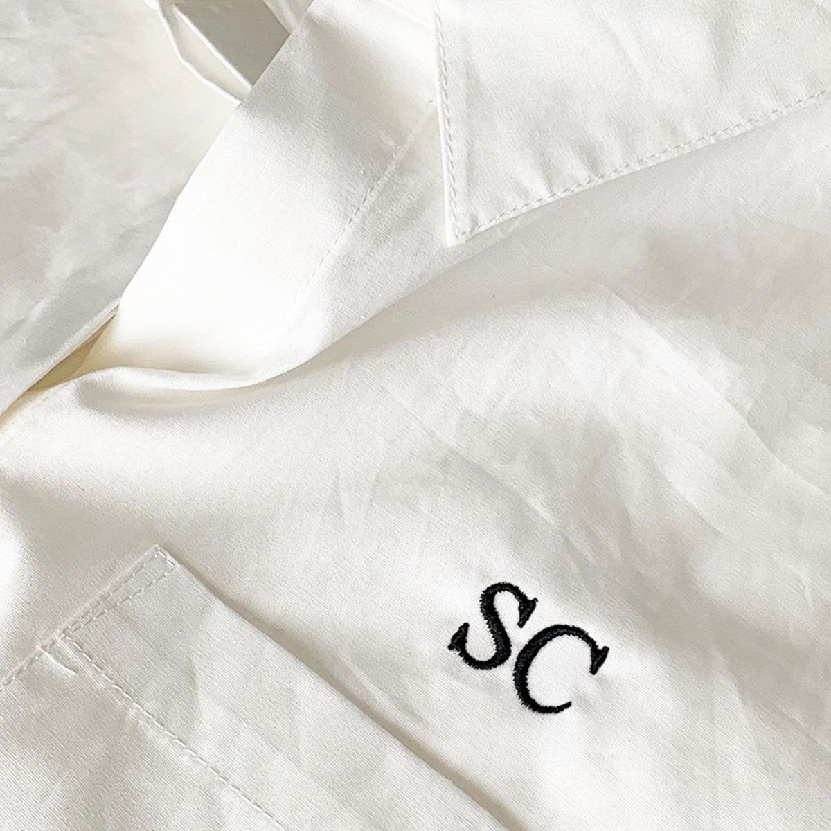 Embroidered initials on shirt