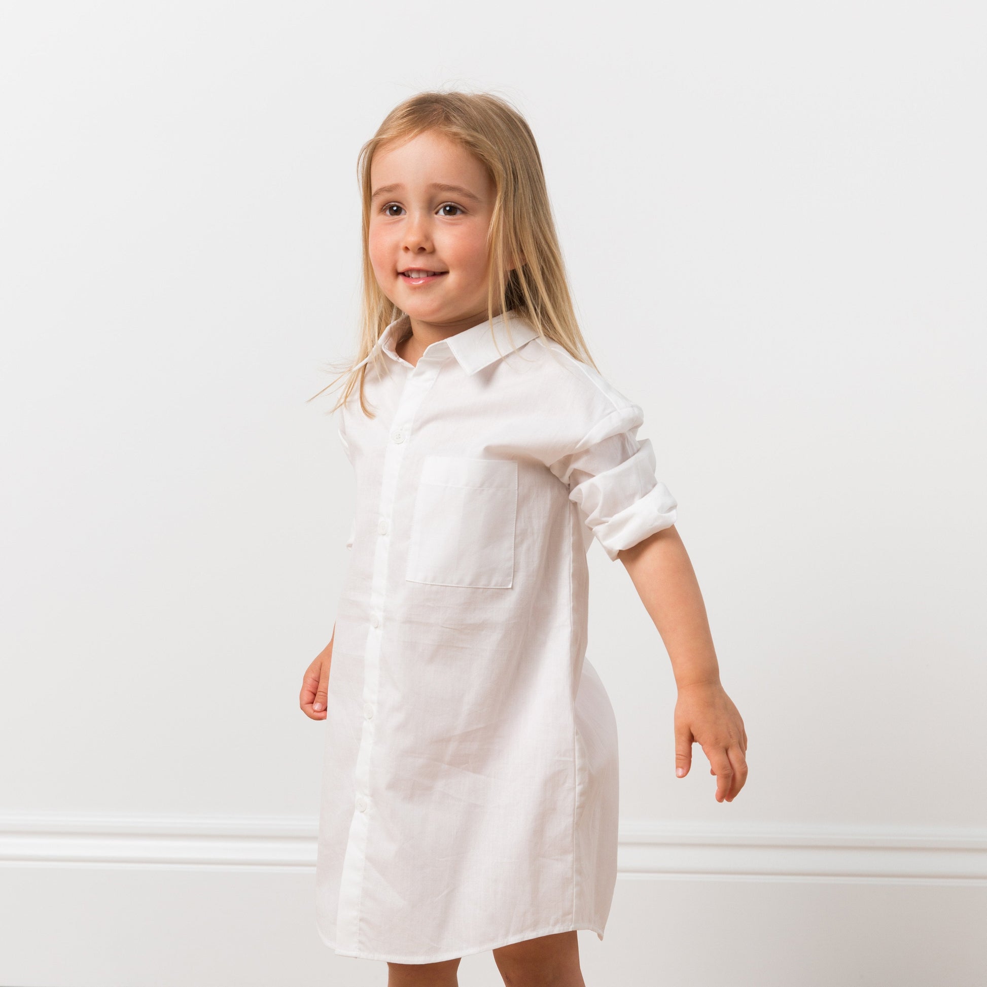 Girl wearing white shirt dress