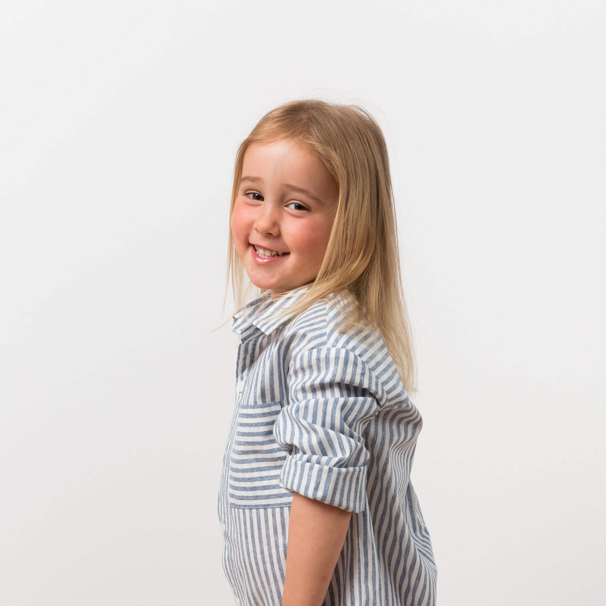 Girl wearing striped shirt dress