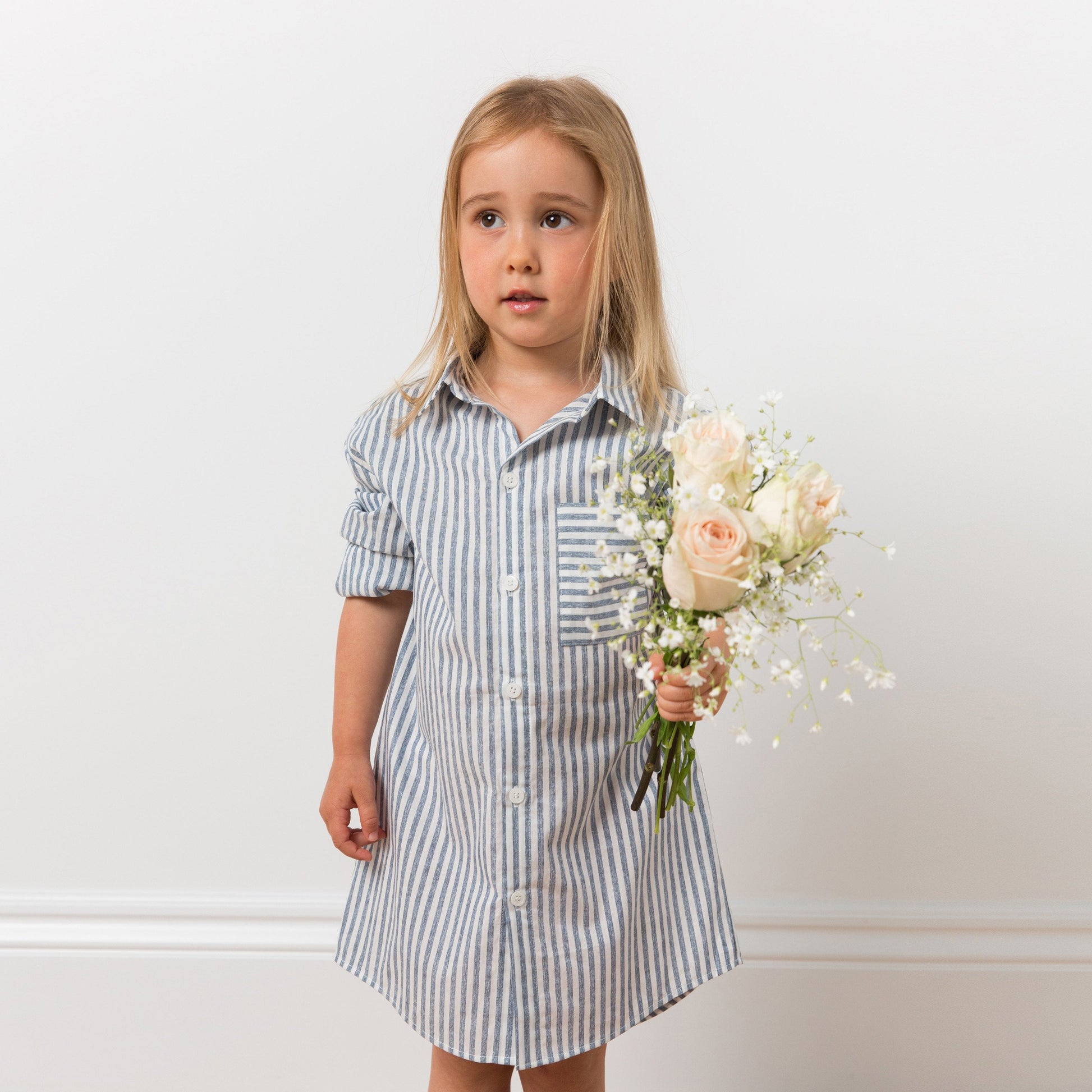 Girl wearing striped shirt dress with flowers