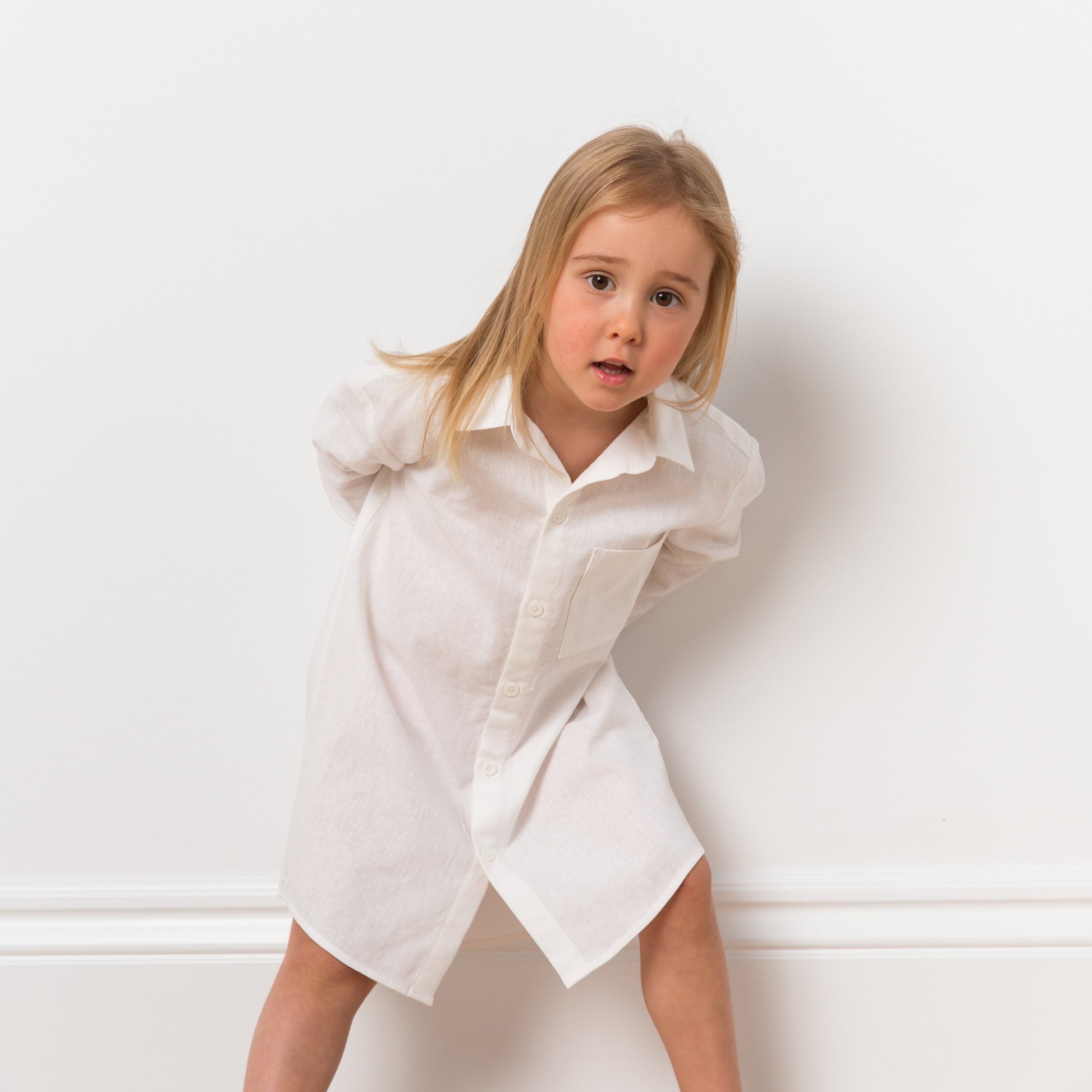 Girl wearing white shirt dress