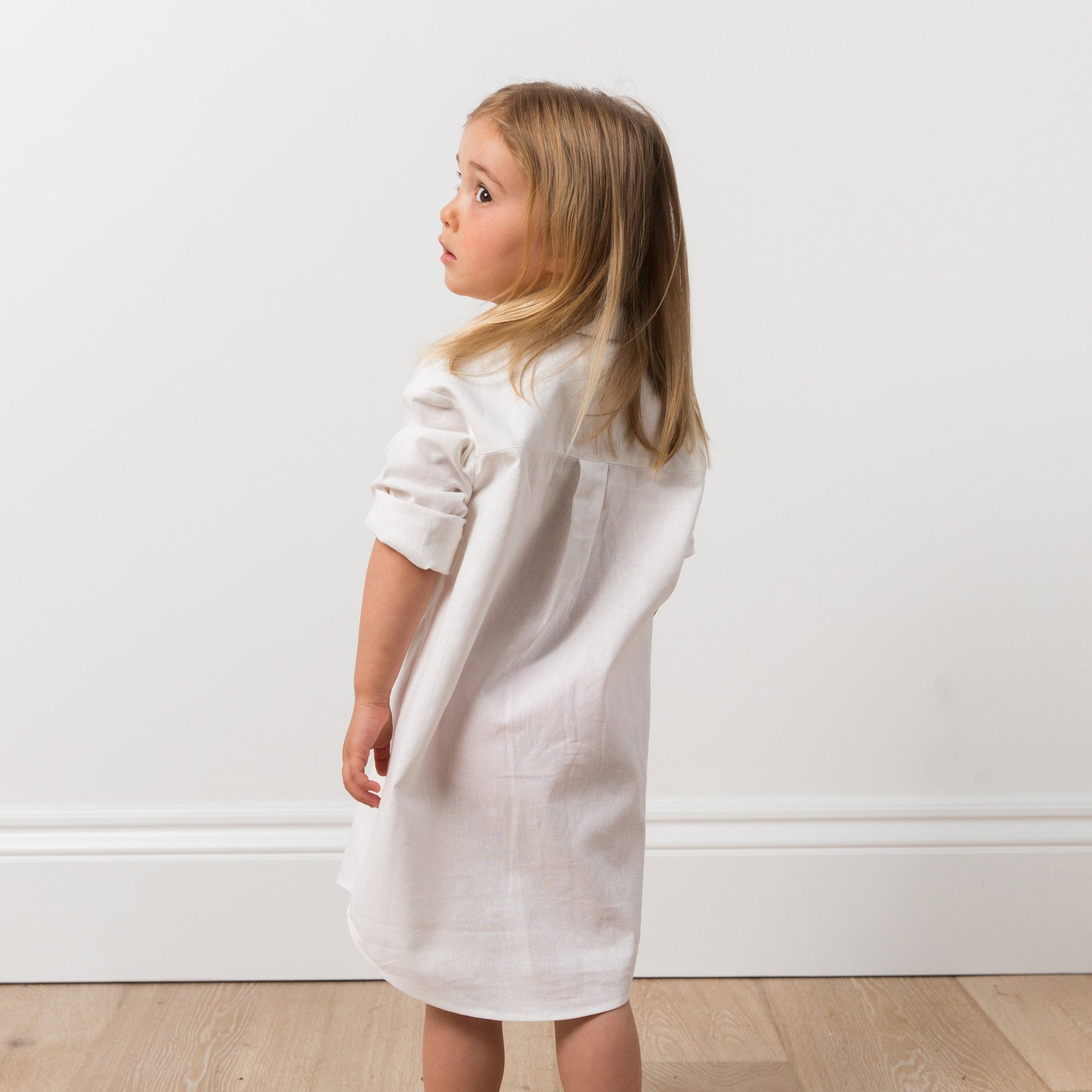 Girl wearing white shirt dress