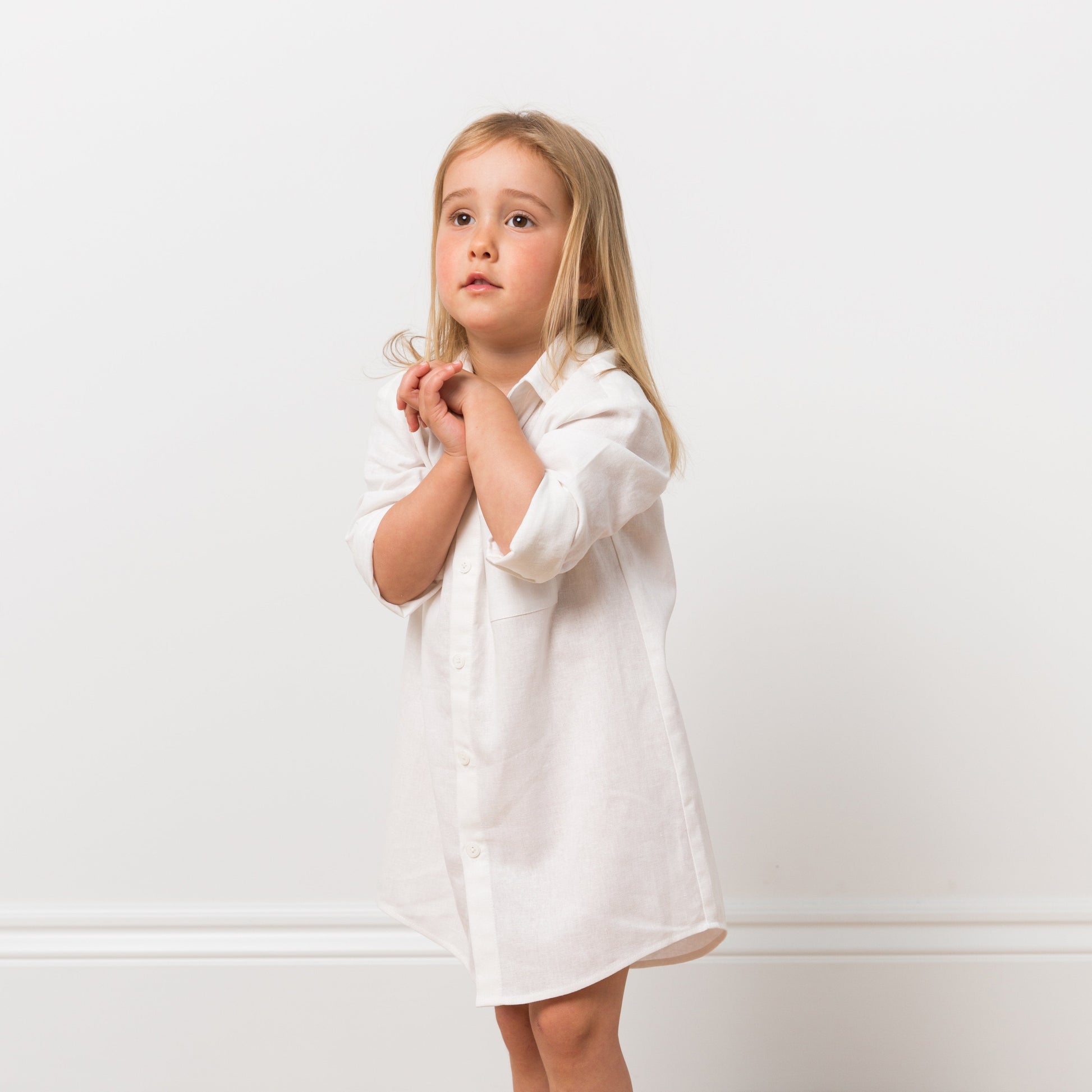 Girl wearing white shirt dress