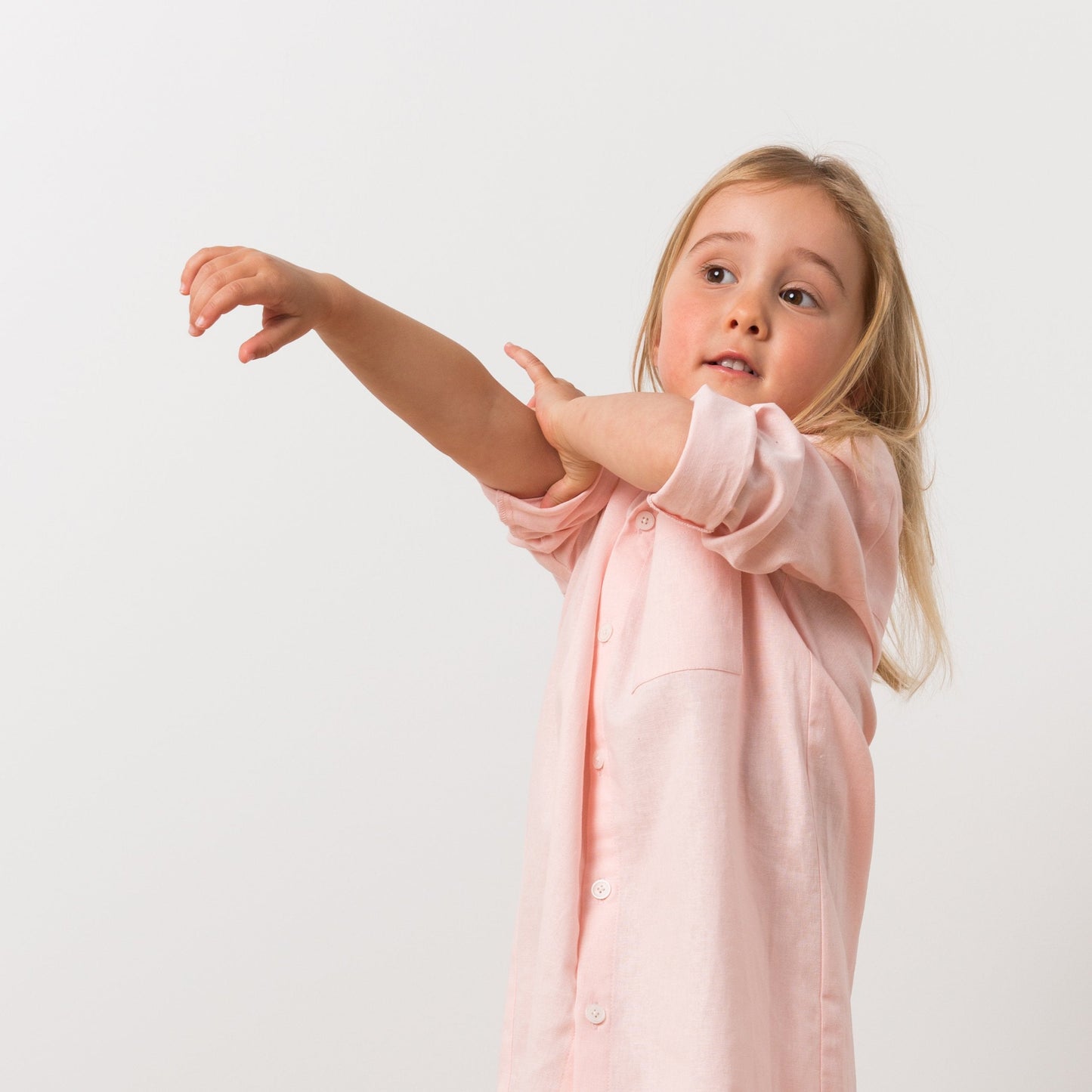 Girl wearing pink shirt dress