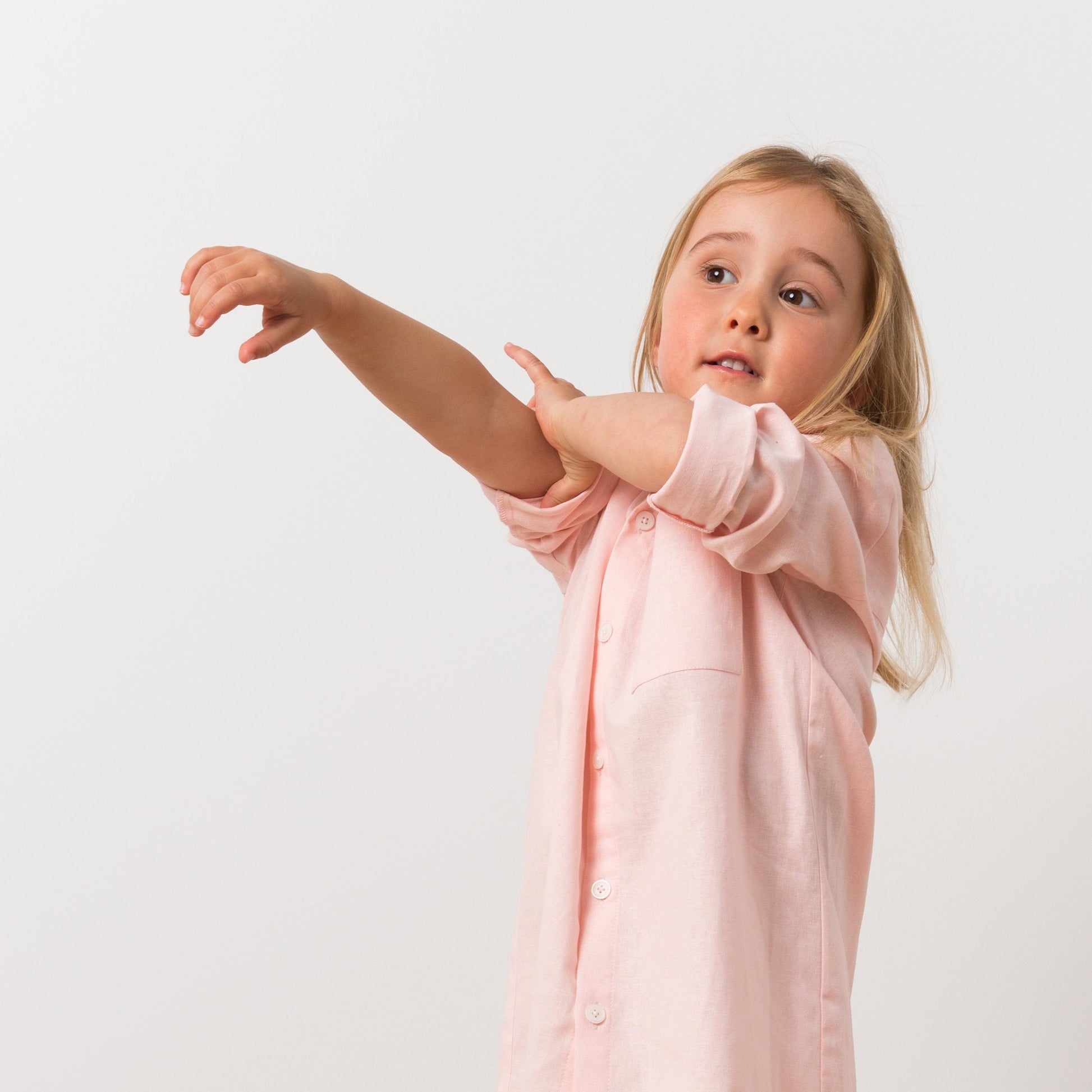 Girl wearing pink shirt dress