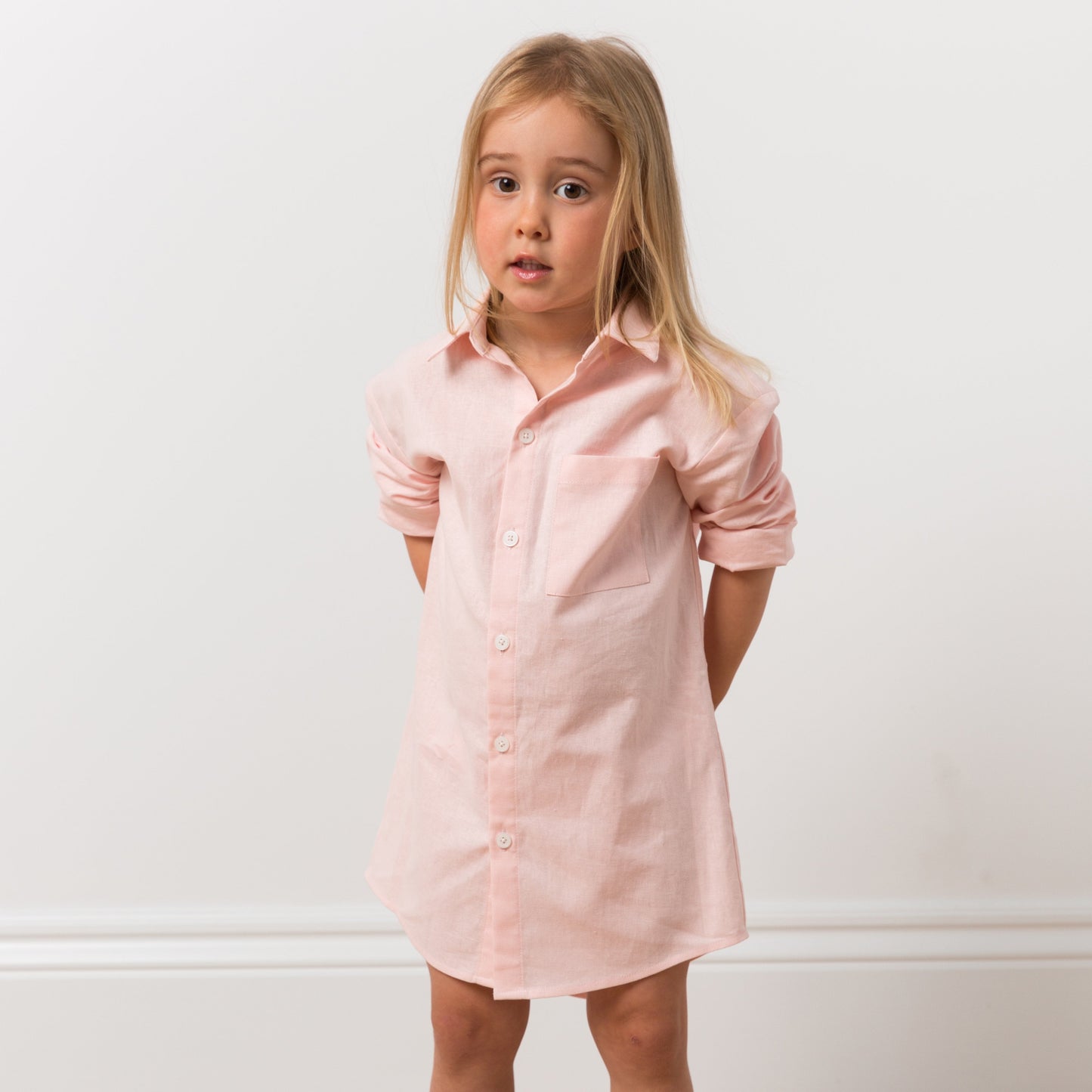 Girl wearing pink shirt dress