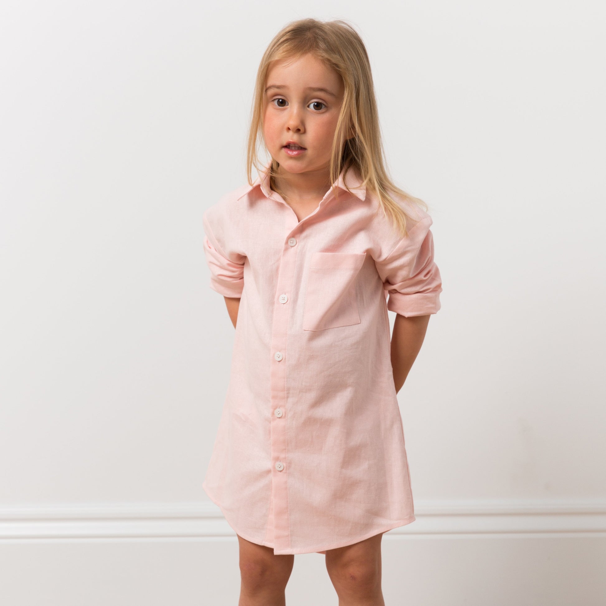 Girl wearing pink shirt dress