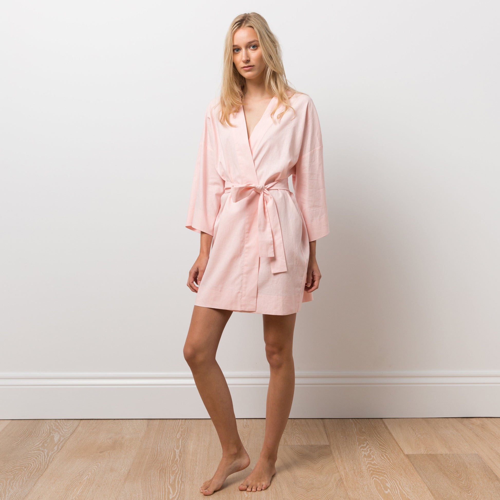 Woman wearing pink robe