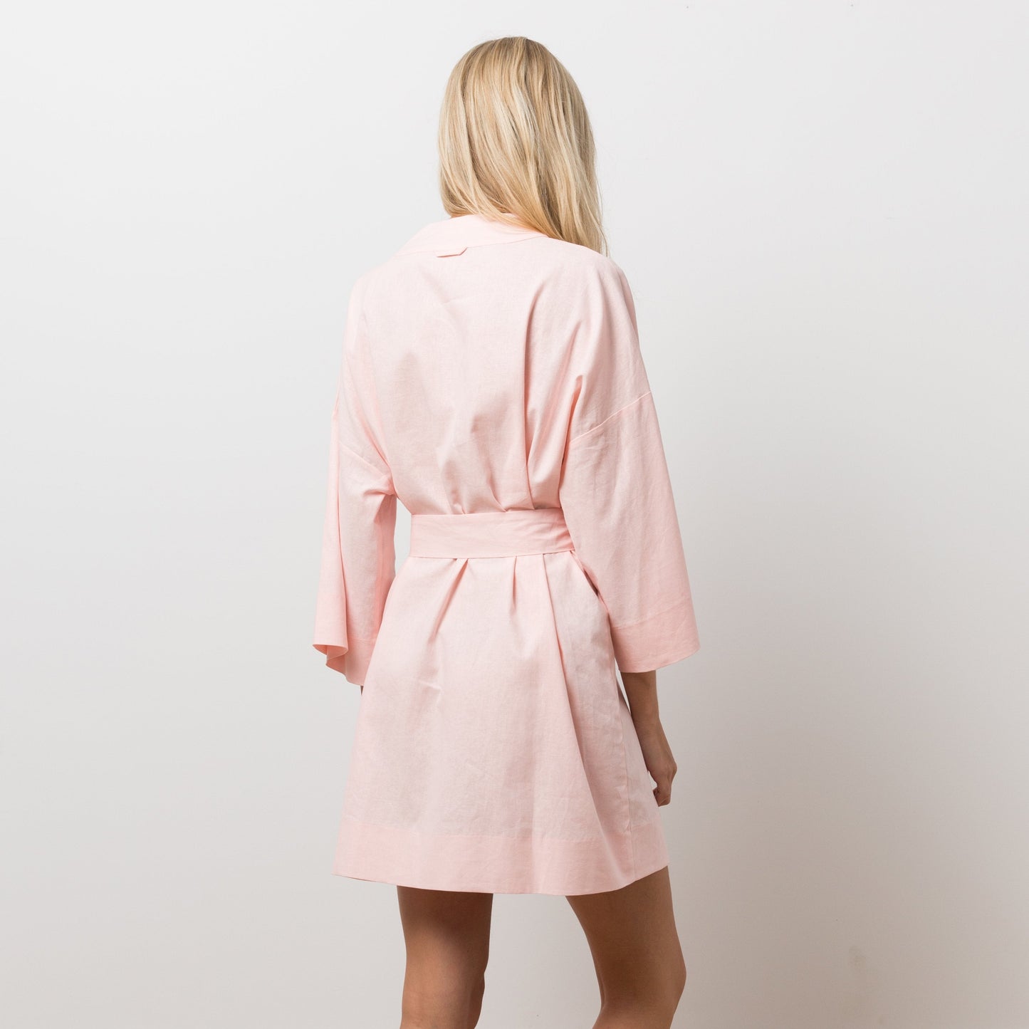 Woman wearing pink robe