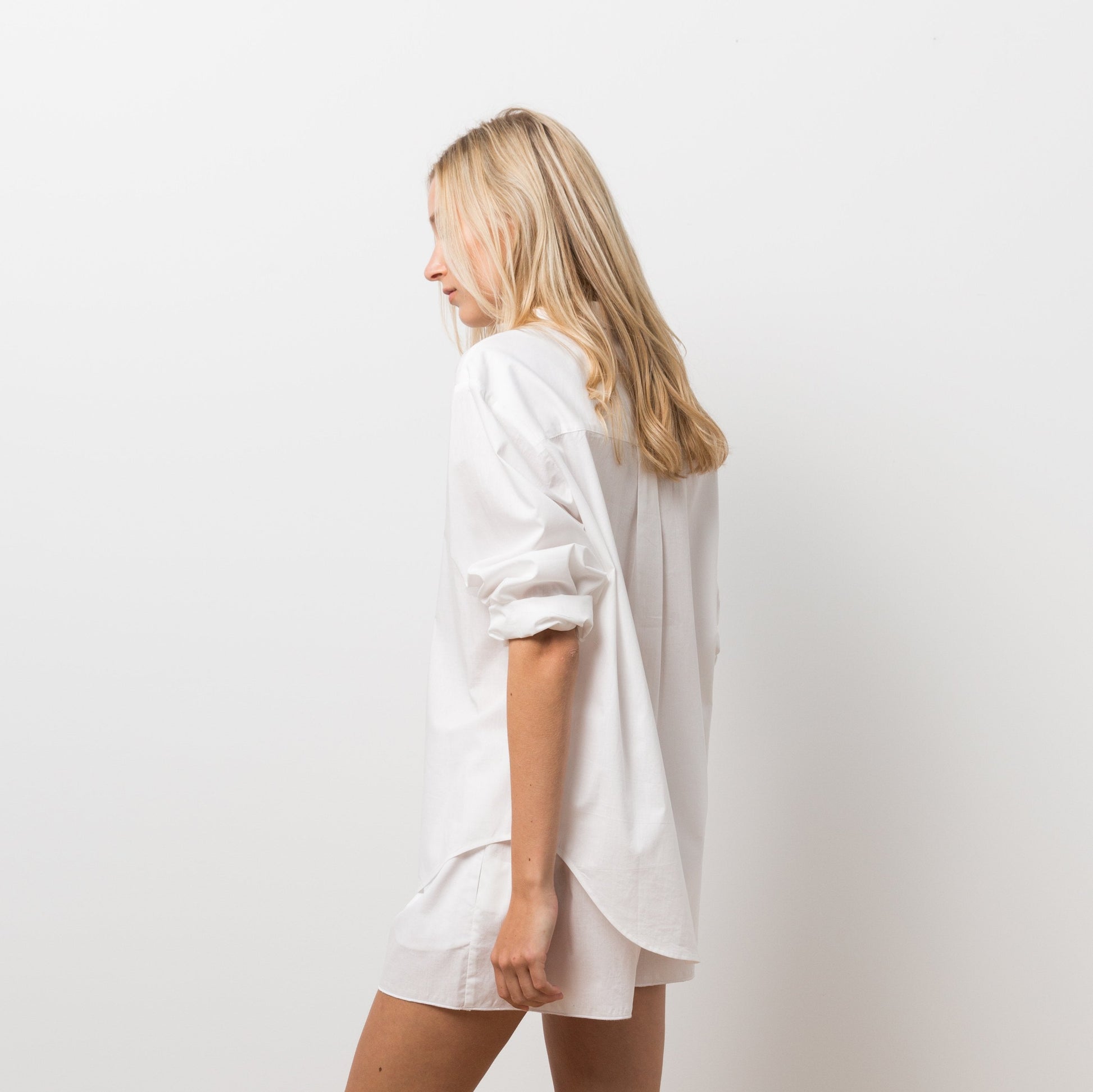 Woman wearing white shirt and shorts