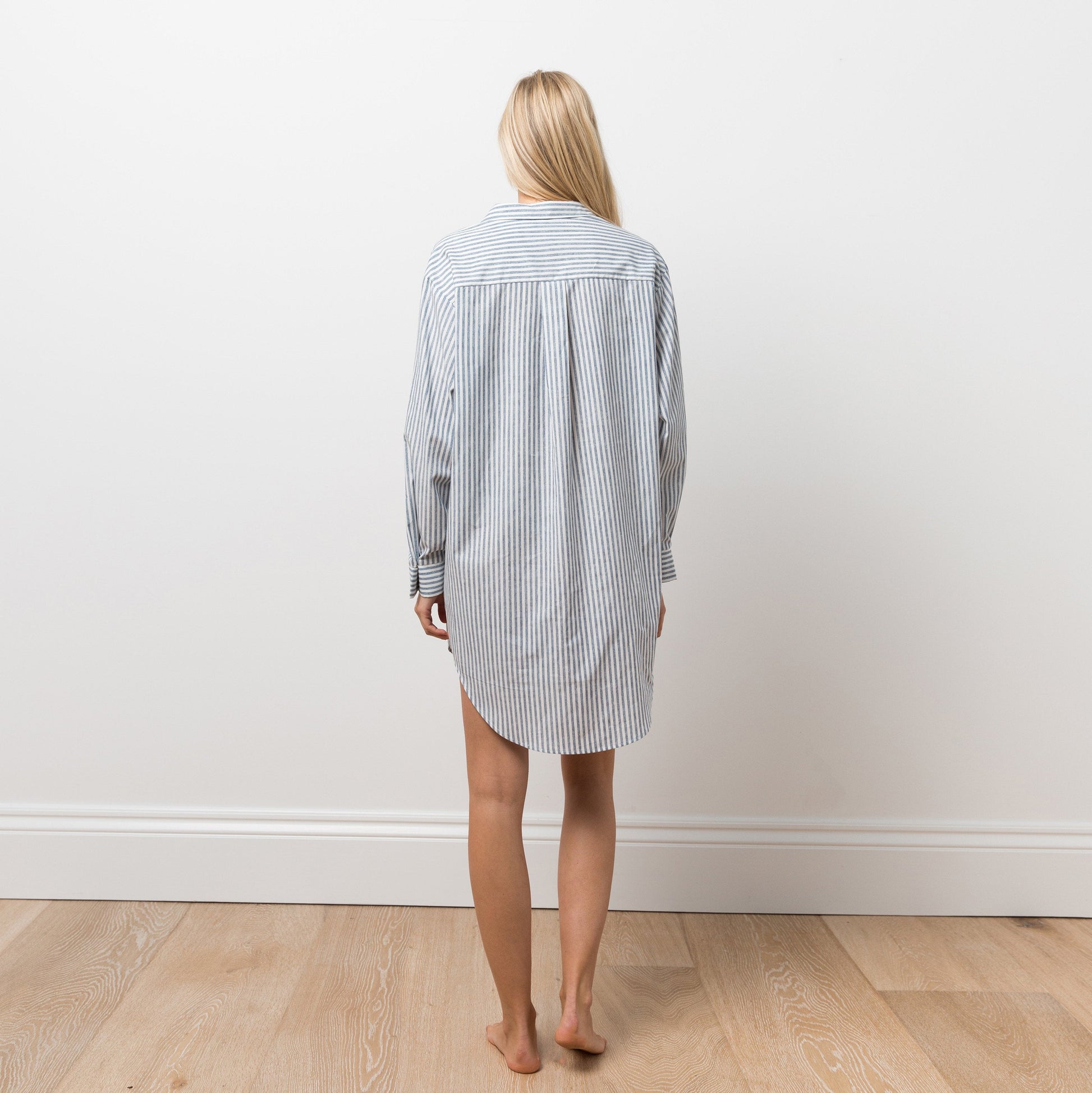 Woman wearing striped shirt dress