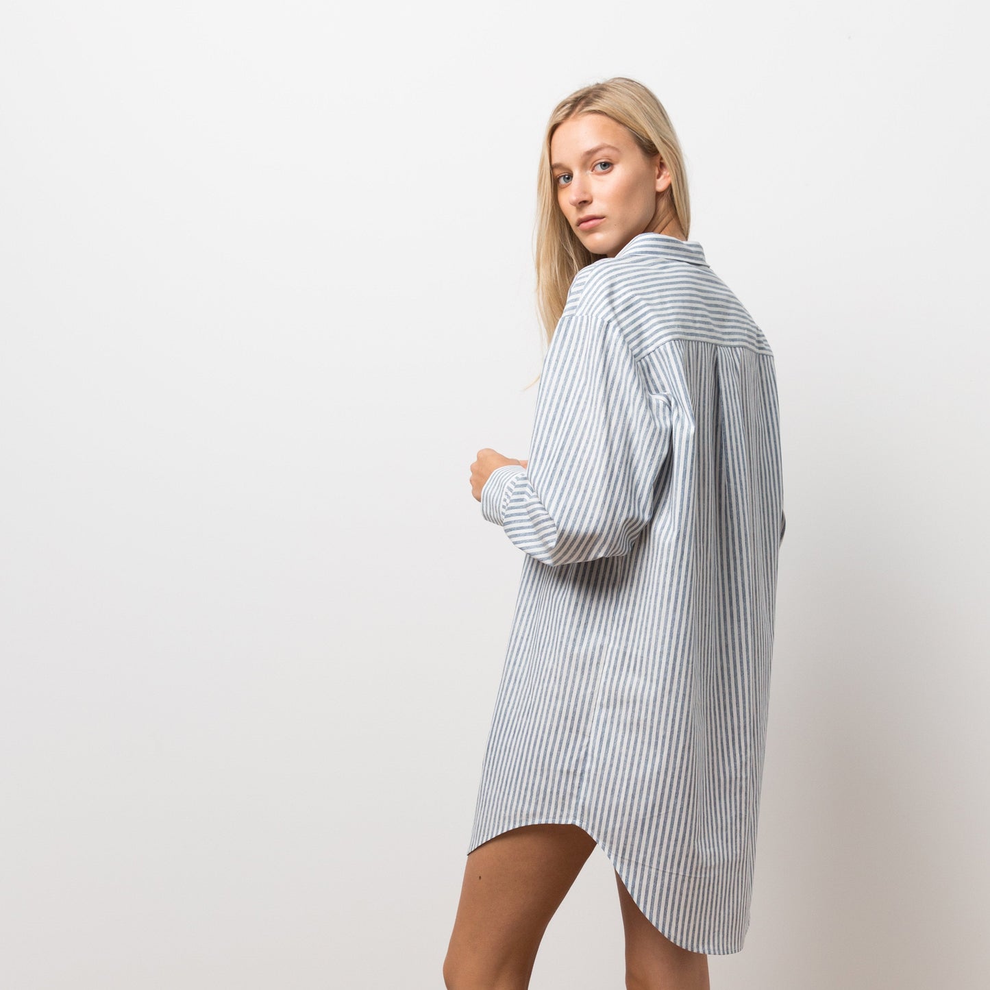 Woman wearing striped shirt dress