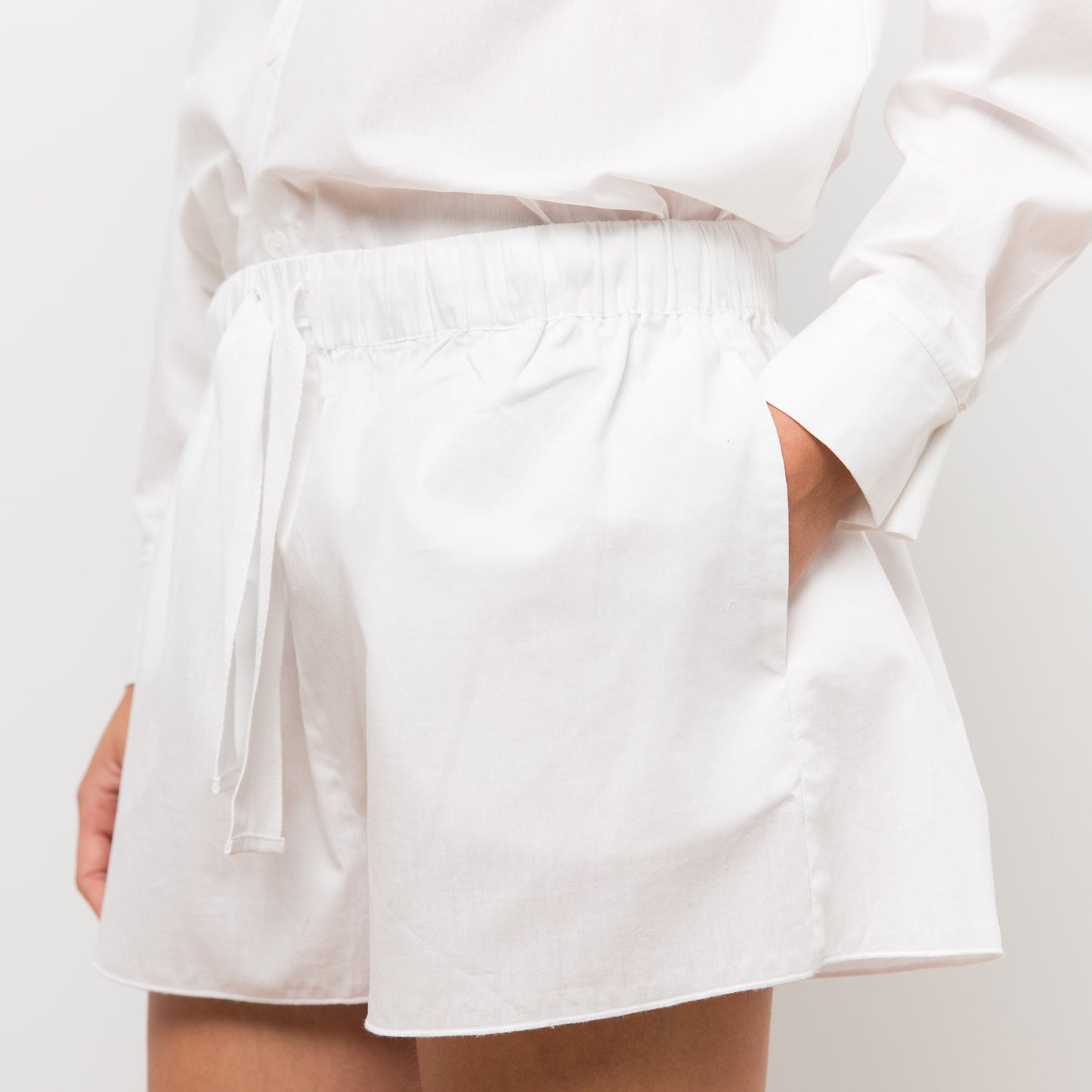 Woman wearing white shorts
