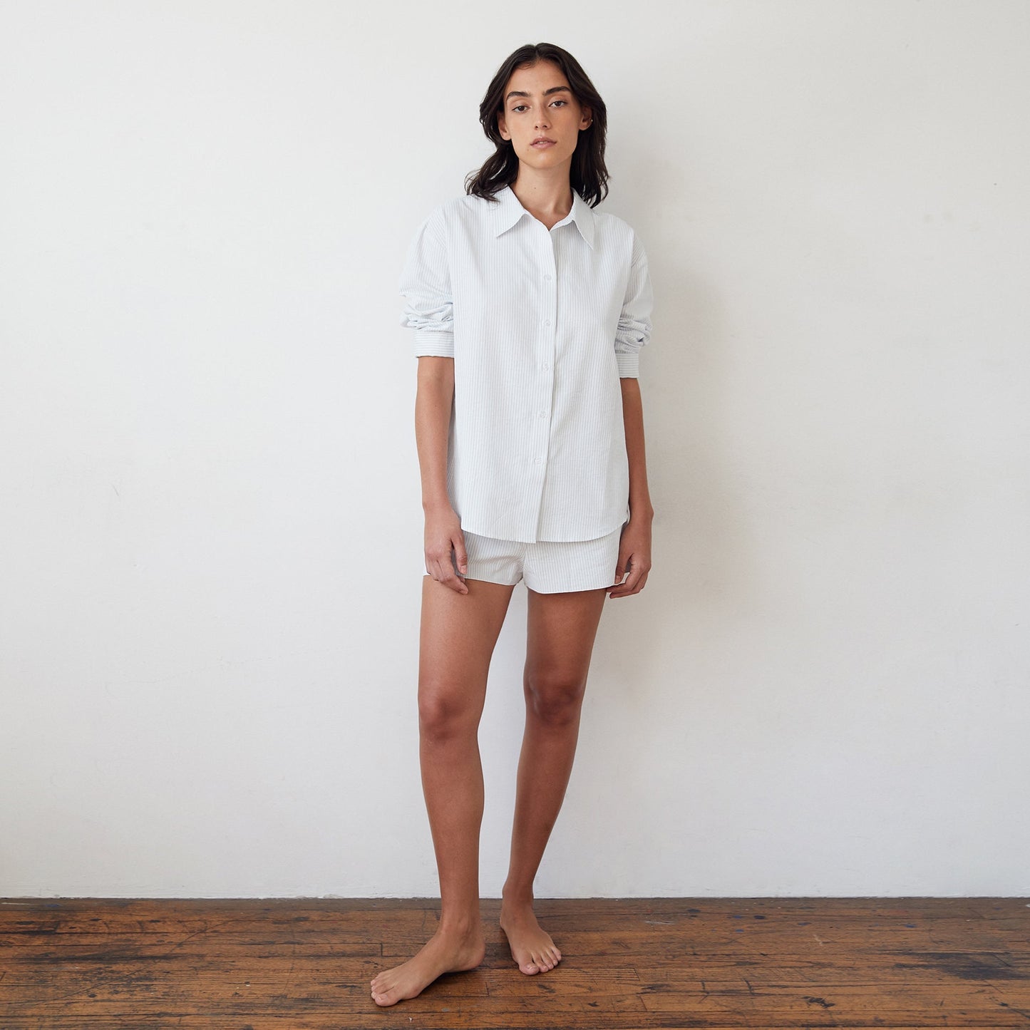 Front view of woman wearing Mathilde Shorts and striped shirt