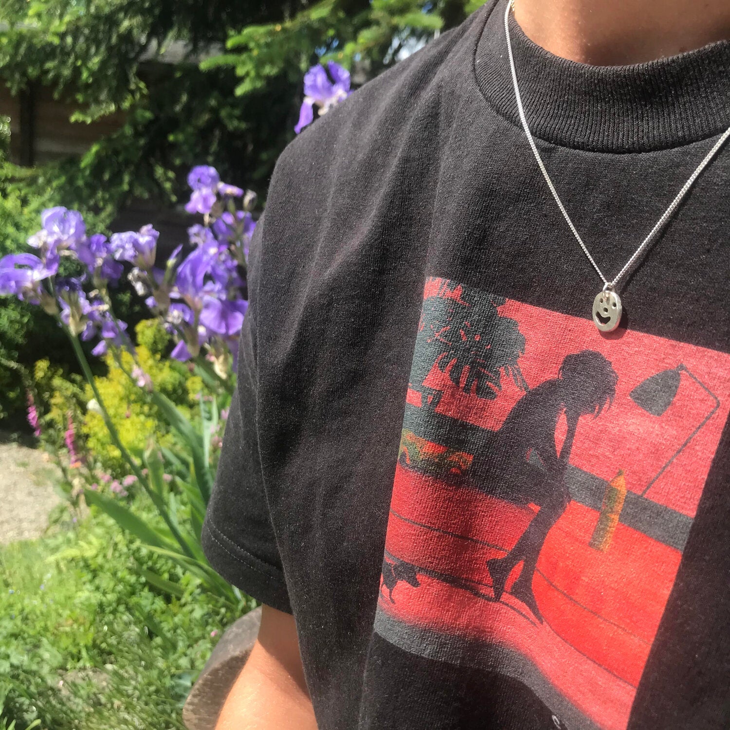 Person wearing silver Smiley Necklace