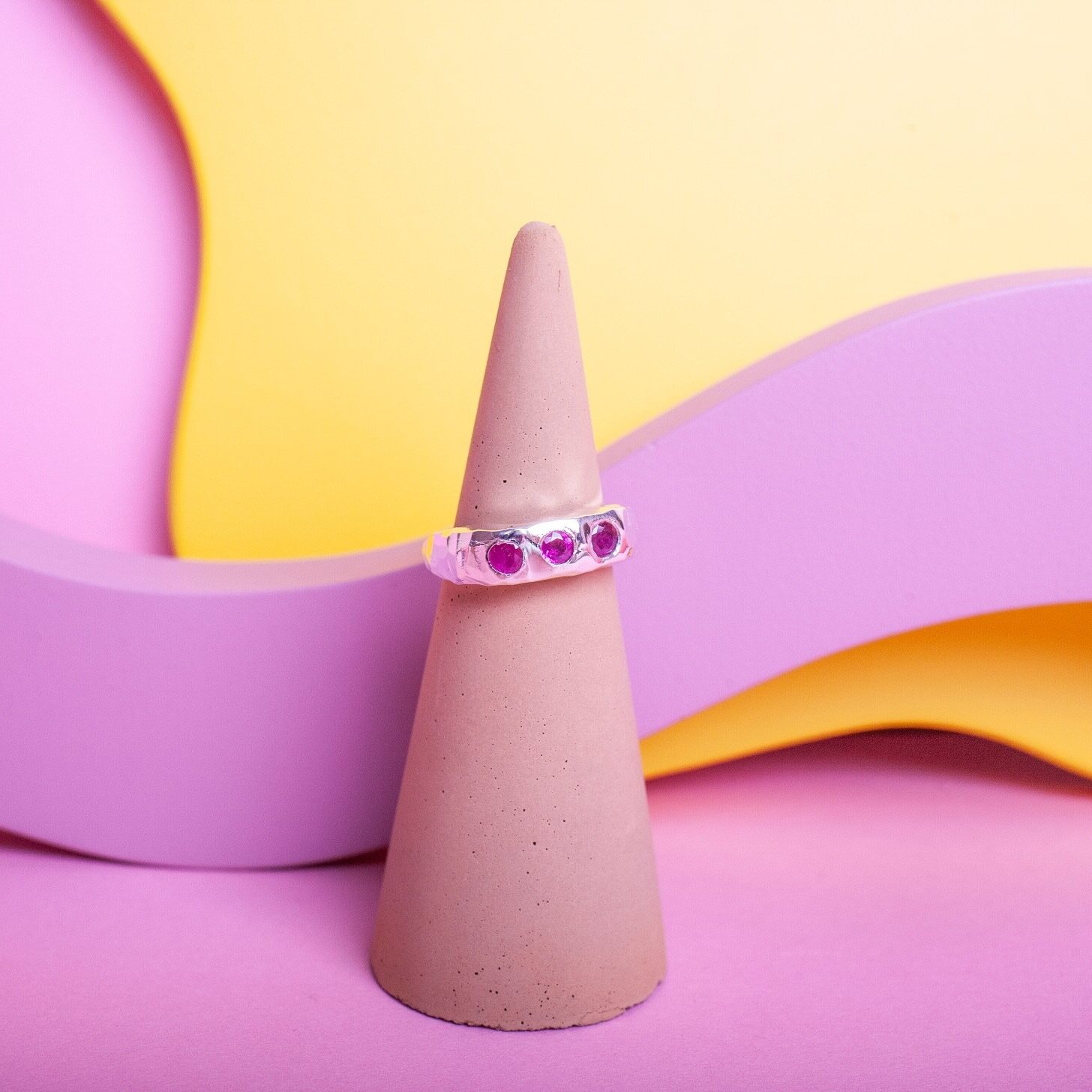Silver ring with 3 pink gems
